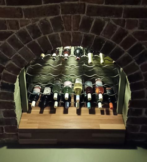 Wine Rack Fireplace, Fireplace Wine Storage, Wine Rack In Fireplace, Fireplace Wine Rack, Fireplace Repurpose Ideas, Converted Fireplace, Repurpose Fireplace, Repurposed Fireplace, Frat Room