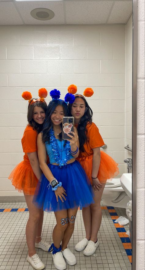 school spirit week, orange school spirit, blue school spirit, friday night lights football, color wars, color tutus, pom pom head bands, mirror picture #schoolspirit #blueout #orangeout #fridaynightlights #football #tutu Orange And Blue Spirit Day Ideas, Orange And Blue Football Outfit, Blue School Spirit Outfits, Blue And Gold School Spirit Outfit, Class Color Day Spirit Week Outfits, School Pride Outfit Ideas, Blue Out Spirit Day, Orange Team Spirit Ideas, School Spirit Day Outfits