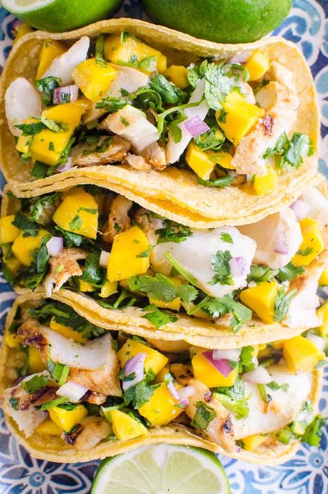 These Grilled Fish Tacos are the perfect addition to your next taco night; combining flavorful grilled white fish (cod, halibut, mahi-mahi) with mango salsa and optional crema creates a wonderfully sweet, savory, spicy meal for all and the best grilled fish tacos recipe ready in under 30 minutes! Cod Tacos, Fish Tacos With Mango Salsa, Best Fish Taco Recipe, Healthy Fish Tacos, Tacos With Mango Salsa, Grilled Cod, Fish Taco Sauce, 30 Minute Meals Healthy, Easy Fish Tacos