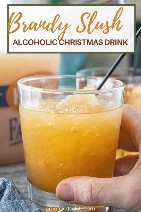 Brandy Slush is an alcoholic drink recipe made at Thanksgiving and Christmas in the midwest. It's a delicious slush recipe made in an ice cream pail - perfect for transporting! #brandyslush #brandyslushrecipe #thanksgivingdrinkrecipes #alcoholicdrinkrecipes #alcoholicchristmasdrinkrecipes #createkidsclub Brandy Slush Wisconsin, Brandy Slush Recipe Without Tea, Brandy Slush Recipe Wisconsin, Holiday Slush Recipes, Christmas Slush Recipes, Brandy Drink Recipes, Christmas Slush, Brandy Slush Recipe, Brandy Drinks