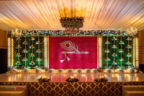 Photo By Wedding Chakra - Decorators Ganapati Stage Decoration Ideas, Tilak Function Decoration, Stage Decorations For Naming Ceremony, Tilak Stage Decoration, Bhagwat Katha Stage Decoration, Dhoti Ceremony Decorations, Dhoti Function Decoration, Naamkaran Decoration Ideas, Flute And Feather