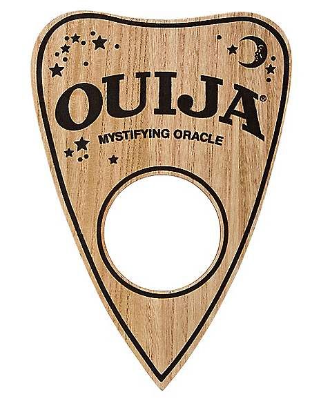 Ouija Board Planchette Sign - Spirithalloween.com Ouija Board Planchette, Ouija Planchette, Horror Gifts, Spencers Gifts, Halloween Front Porch, Skateboard Design, Ouija Board, Victorian Steampunk, Hung Up