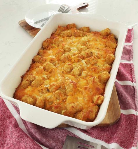 Breakfast casserole with tater tots is an easy recipe. The tater tots stay crispy with a layer of gooey cheese, sausage and eggs. Perfect recipe for brunch, holidays and even Christmas morning. Easy Breakfast Casserole With Tater Tots, Breakfast Tot Casserole, Breakfast Casserole With Tater Tots Easy, Tater Tot Egg Bake, Easy Tater Tot Casserole Simple, Egg Tater Tot Casserole, Breakfast Casserole With Tater Tots, Casserole With Tater Tots, Sausage Egg Bake