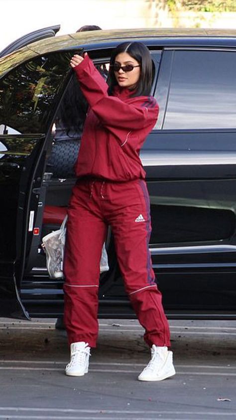 Track suits - These trends are all over social media now, but we'll definitely regret wearing them a few years down the line. Red Tracksuit Outfit Women, Nike Track Suits For Women, Kylie Cars, Adidas Tracksuit Women Outfit, Tracksuit Outfit Women Street Styles, Tracksuit Outfit Women, Track Suit Outfit, Ropa Kylie Jenner, Look Kylie Jenner