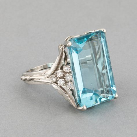 A lovely vintage ring, made in France circa 1960.  The craftmanship in platinum is quality, the side and basket part have a Floral design. French hallmark for platinum: the old man. The aquamarine has a pretty intense light blue color. Dimension on Aquamarine: 20*14mm for the front. Ring size: 51.5 or 5.80 USA. Weight: 13.10 grams. Aquamarine Ring Vintage, French Jewelry, Aquamarine Jewelry, Aquamarine Ring, Rock Stars, Bling Rings, Vintage Jewels, Multi Stone Ring, Vintage Ring