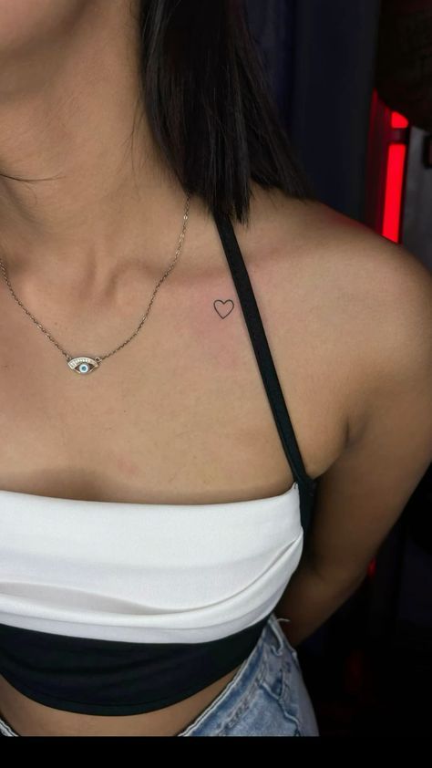 Over The Heart Tattoo, Women Upper Chest Tattoo, Heart Tattoo On Chest Women, Small Clavicle Tattoo, Tattoo Near Chest, Heart Tattoo On Collar Bone, Heart Collar Bone Tattoo, Red Heart Tattoo On Chest, Small Tattoos Collar Bone