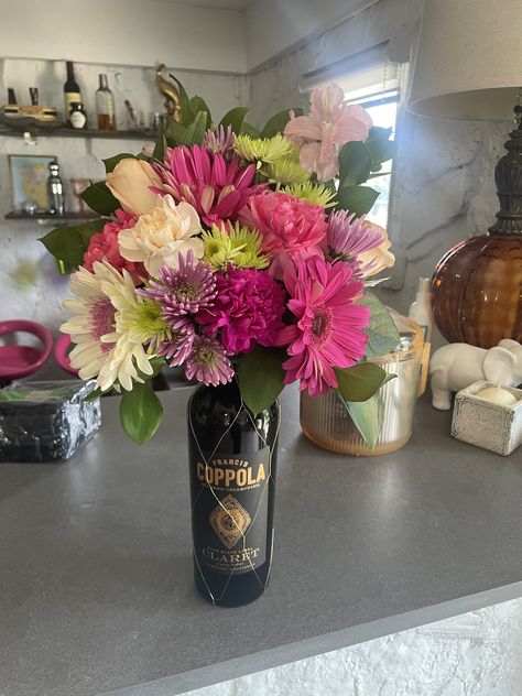 Flower Arrangements With Wine Bottles, Flowers With Bottle, Bottle With Flowers On Top, Wine Bottle Arrangements, Wine Bottle With Flowers On Top, Bottle Vases With Flowers, Wine Bottle Flower Arrangements, Bottle Flower Arrangements, Mini Alcohol Bottles Gifts