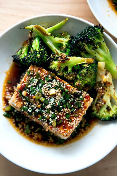 Warm Tofu with Spicy Sesame Sauce — a winter favorite! This is by far the easiest method of preparing tofu I have encountered. The recipe calls for simmering tofu in water — sounds odd but it works — making a sauce, and pouring the sauce over the tofu. It takes no time to prepare, costs very little, and is so incredibly delicious. #tofu #warm #spicy #sauce #sesame #soy Broiled Broccoli, Spicy Garlic Sauce, Mapo Tofu, Sesame Sauce, Green Bean Recipes, Tofu Recipes, Garlic Sauce, In Water, No Time