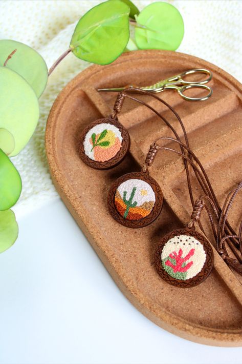 Hand embroidery pendants. Embroidered with French Knot technique in a wooden pendant base. Embroidery Pendants, Embroidery Boho, Embroidered Pendant, Embroidered Jewelry, Embroidered Necklace, French Knot, Wooden Pendant, Boho Jewelry, Hand Embroidery