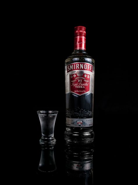 A Smirnoff vodka bottle reflected on a sheet of black acrylic with a shot glass. Download this photo by William Warby on Unsplash Smirnoff Black, Smirnoff Red, Blackberry Cocktail, Malibu Rising, Smirnoff Vodka, Russian Revolution, Architecture Art Design, Vodka Drinks, Coconut Rum