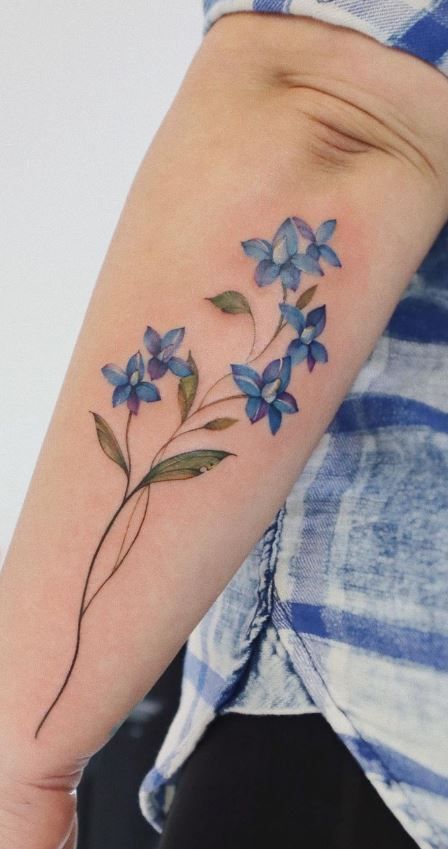 100 Meaningful Larkspur Tattoo Designs - Tattoo Me Now Larkspur And Snowdrop Tattoo, Delphinium Flower Tattoo, Larkspur Flower Tattoo, Delphinium Tattoo, Larkspur Flower Tattoos, Flower Tats, Violet Flower Tattoos, Larkspur Tattoo, Dahlia Tattoo