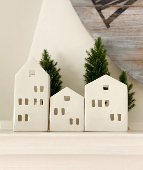 "These white ceramic tea light houses/pencil holder will be good addition to your home/office deco. Ideal for placement on any mantel, desk, table top/ condole and side table. Also using as pencil holder. Dimensions Tall: 2.5\" W x 2.5\" D x 5.5\" H Medium: 3\" W x 2.5\"D x 4\" H Small: 2.5\" W x 2.5\" D x 3.5\" H" White Ceramic Candle Holders, Ceramic Tea Light Houses, White Ceramic Houses, Tea Light Houses, Tealight House, Nordic Houses, Canadian Christmas, Christmas Pottery, Nordic House