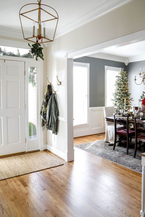 Hanging Mistletoe in the Foyer Hanging Mistletoe Ideas, Pottery Barn Dishes, Hanging Mistletoe, Christmas Salad Plates, Greenery Christmas, Christmas Dining Table, Christmas Dining Room, Foyer Lighting, Ceramic Houses