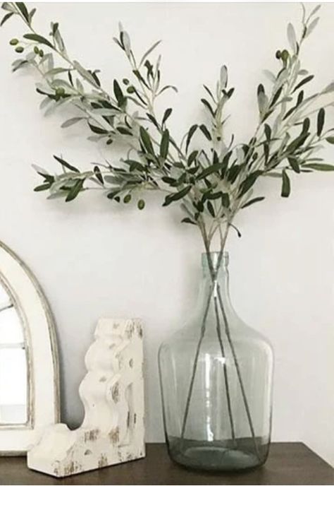 Olive Branch In Vase, Olive Branches In Vase, Entryway Layout, Clear Vase Decor Ideas, Clear Vase Decor, Mexican Style Decor, Foliage Arrangements, Vase With Branches, Large Glass Vase