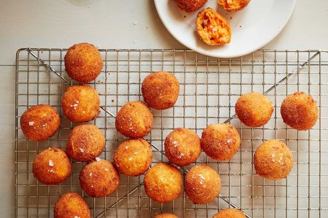 Sweet potatoes and cheese are flavored with cumin, smoked paprika, black pepper and cayenne for warmth, smokiness and a little bit of a kick Once these croquettes are breaded and deep fried, a crisp crust delicately encapsulates the soft and gooey mixture within They are very straightforward to prepare, but the process makes them a labor of love, perfect for entertaining or simply showing off your kitchen prowess. Ny Times Recipes, Nyt Recipes, Croquettes Recipe, Potato Croquettes, Thanksgiving Appetizer Recipes, Savory Bites, Salad With Sweet Potato, Nyt Cooking, Thanksgiving Appetizers