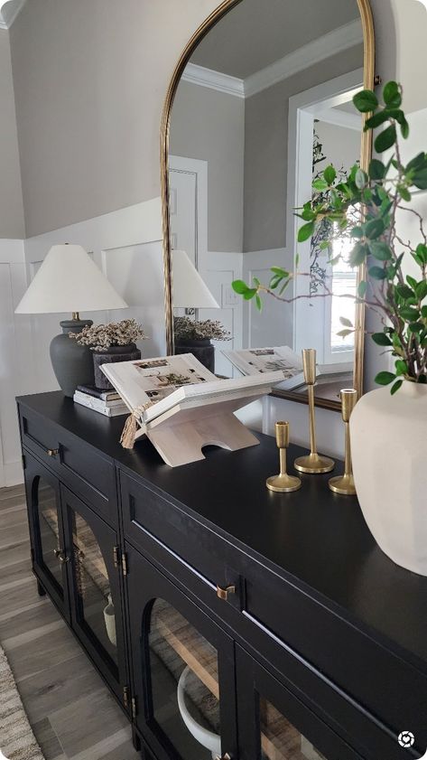 Entryway With Gold Mirror, Black And Gold Rustic Decor, Black Entry Console, Black Console Table Dining Room, Black And Gold Entrance Decor, How To Style A Entryway Table, Arched Entryway Mirror, Black And Gold Entryway Decor, Mirror Console Table Decor