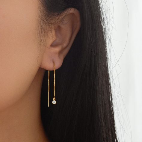 Sleek and contemporary, this pair of threader earrings feature a shiny gold chain from which hangs tiny but brilliant cubic zirconia charm. This listing is for a pair of earrings. All materials are 14K gold filled and are tarnish resistant, water resistant, and hypoallergenic. Gift box included with purchase. Chain measures 8 cm long with a 20 gauge. Cz measures 3.8mm in diameter --------------------♥ PROMOS ♥-------------------- Want 10% off? Join the mailing list by visiting http://bit.ly/vede Moonstone Earrings Gold, Gold Threader Earrings, Formal Earrings, Threader Earrings Gold, Earrings Chain, Gold Bridesmaids, Drop Earrings Gold, Prom Earrings, Gold Dangle Earrings