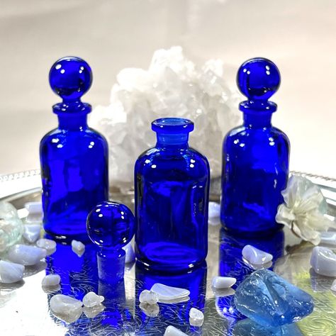 Apothecary Bottles 1 oz. (30 ml) COBALT BLUE Glass Perfume Bottle with Ground Glass Stopper top UV PROTECTIVE INCLUDED: 1, 3 or 12 Glass 30 ml (1 oz.) Apothecary Perfume Bottles1, 3 or 12 Ground Glass Stopper Tops COLOR OPTIONS:This listing is for COBALT BLUE but we offer: Clear and Cobalt blue (UV Protective) and Green Our Glass Apothecary Bottles are OLD WORLD STYLE, perfect for so many different cosmetic and craft applications. PRODUCT IDEAS/USES:Alchemy, Aromatherapy Blends, Attars, Birthday Glass Perfume Bottles, Old Perfume Bottles, Cologne Bottle, Blue Things, Blue Perfume, Aromatherapy Blends, Cobalt Glass, Apothecary Bottles, Essential Oil Bottles