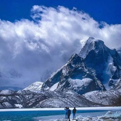 Gurudongmar Lake, nestled in North Sikkim, India, is a breathtaking high-altitude lake situated at an elevation of about 17,800 feet (5,430 meters). It holds immense spiritual significance for both Buddhists and Sikhs, named after Guru Padmasambhava and Guru Nanak respectively. The lake remains frozen for the majority of the year, except for a small portion that melts even in the winter, considered sacred by locals. Gurudongmar Lake, North Sikkim, Guru Padmasambhava, Guru Nanak, High Altitude, In The Winter, The Winter, Hold On, Frozen