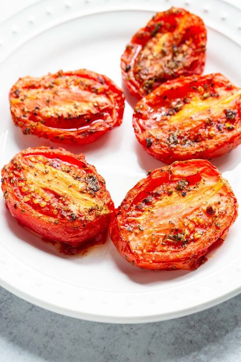 Air fryer roma tomatoes are easy to make and so flavorful. These roasted air fryer roma tomatoes can be used to make soups and sauces or simply paired with pasta or garlic bread. Roma Tomato Recipes, How To Make A Poached Egg, Baked Pears, French Toast Sticks, Grilled Fruit, Pineapple Recipes, Baked Fruit, Homemade Tomato Sauce, Crispy Onions