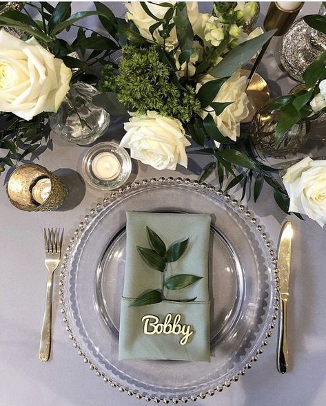 Layered mid tones of grey and sage green and lifted with neutral florals and candlelight to create this beautiful tablescape. Designed by Ambience York at Bunny Hill, York.  Table Decor | Wedding Table Decor | Place Setting | Charger Plates | Colour Palette | Sage Green | Grey | Wedding Decor | Wedding Decorations | Neutral Florals | Tablescape | Wedding Tablescape | Wedding Table Inspiration | Wedding Reception | Wedding Reception Decor Wedding Plate Setting, Green Table Settings, Grey Wedding Decor, Wedding Table Place Settings, Green Tablescape, Sage Green Wedding Colors, Expo Ideas, Winter Wedding Table, 21 Diner