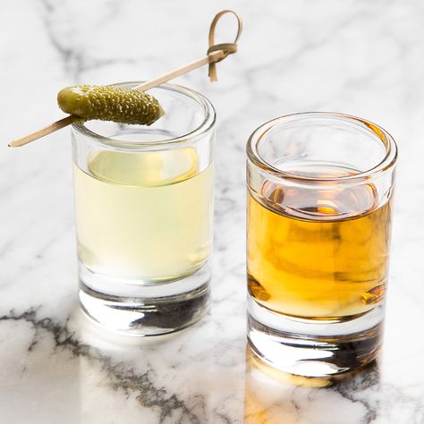 If you love picklebacks (which, of course, you do), you're going to want to try this new iteration, straight from the original source itself. Pickle Juice Cocktail Recipe, Pickle Shot, Pickle Back Shots, Pickle Back, Drinking Pickle Juice, Pickled Watermelon Rind, Wedding Foods, Watermelon Pickles, Infused Liquors