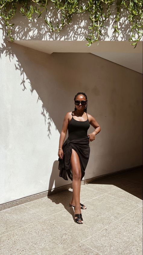 Black Swimsuit | Black Sarong | Coastal Chic Outfits | Beach Essentials | Poolside | Summer Vacation in Greece | Black Girl Luxury All Black Vacation Outfit, Black Vacation Dress, Black Sarong For Spring Vacation, Black Sarong Outfit, Black Beachwear Swim Dress For Pool, Black Sarong For Beach Vacation, Sarong Outfit, Beach Outfit Black Women, Black Beachy Cover-up For Vacation