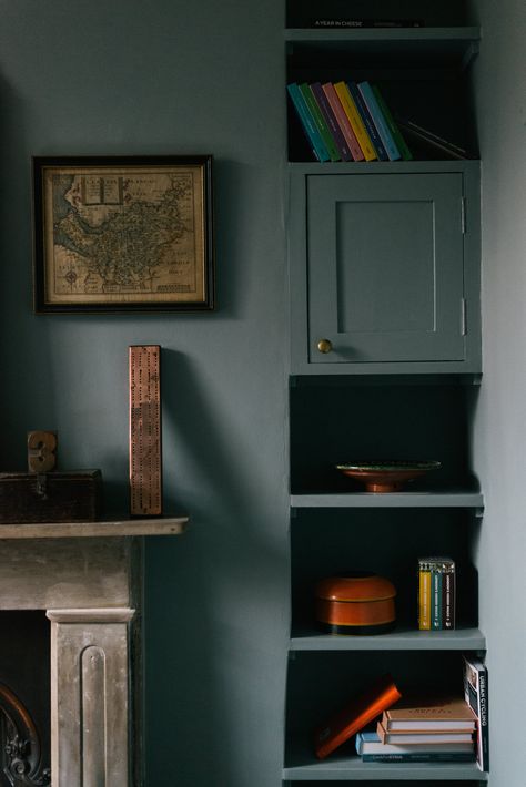 Painting the cupboard, walls and shelf in the same 'Oval Room Blue' by Farrow & Ball creates a beautifully atmospheric look. Oval Room Blue Dining Room, Oval Room Blue Hallway, Oval Room Blue Living Room, Oval Room Blue Bedroom, Oval Room Blue Farrow And Ball, Kittiwake Farrow And Ball, Farrow And Ball Blue, Blue Wall Paint, Blue Cupboard