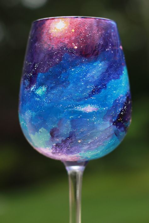 Hand Painted Wine Glass #galaxy #universe #cosmos #Halloween #Magic #AstralTravel #Energy #Divine #Feathers #Wings #Raven #Galaxy #Crescent #Moon #Stars #Witch #Gypsy #Universe Pebeo Porcelaine 150, Wine Glass Designs, Diy Wine Glasses, Hand Painted Glasses, Wine Glass Crafts, Wine Glass Art, Painted Glasses, Hand Painted Wine Glasses, Painting Glassware