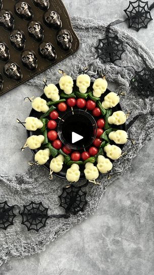 4.9K views · 1.1K reactions | Check out the final recipe in our October Skull Series! These creepy caprese skewers are made with skull shaped mozzarella balls, baked in the oven! 💀🍃🍅

This easy appetizer is the perfect way to spook up your classy Halloween party with only three simple ingredients, made in our Skull Bites Pan. Check out the full recipe below!

Caprese Mini Skull Skewers:
🧀50 mozzarella pearls
🍃20 basil leaves
🍅20 cherry tomatoes

Preheat your oven to 350 degrees. Brush your pan lightly with oil.

Fill each cavity in the mold with 2.5 mozzarella pearls. Do not overfill the pan!

Bake for 6-8 minutes until pearls are soft and expressed liquid begins to bubble.

Remove from the oven and firmly press the warm pearls into the mold with a folded paper towel to remove as muc Classy Halloween Party, Mozzarella Pearls, Mozzarella Balls, Caprese Skewers, Classy Halloween, Folded Paper, Basil Leaves, Appetizers Easy, Skewers