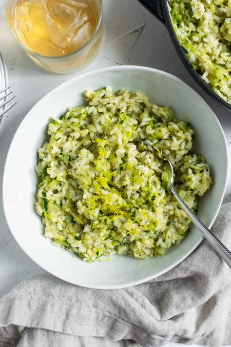 Zucchini risotto is a vibrant, veggie-loaded dish that features juicy shredded zucchini folded into a delightfully creamy and zippy mixture of tender arborio rice, rich broth, nutty Asiago cheese, and bright lemon juice and zest. #zucchinirisotto #zucchinirecipe #healthydinner #risotto #risottorecipe #courgetterisotto #courgetterecipe #zucchini #dinnerideas #weeknightdinner Zucchini Risotto, Zucchini Rice, Zucchini Sticks, Homemade White Bread, White Bread Recipe, Risotto Rice, Rice Varieties, Asiago Cheese, Arborio Rice