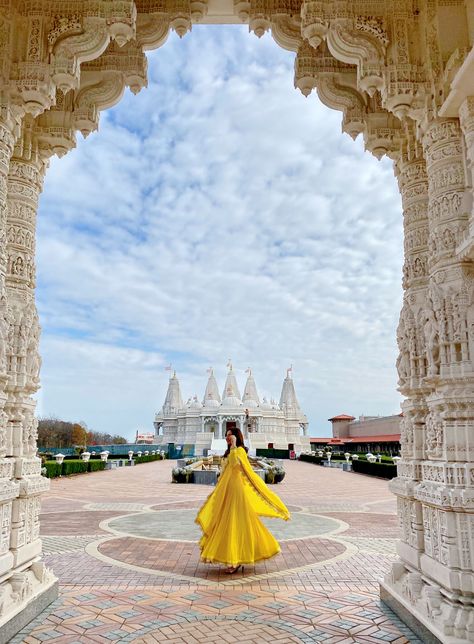 Hello Jalebi Anarkali outfit worn by Chicago blogger BrownGirlStyles at the Baps Mandir.  Twirling #Mughal #mughalfashion #Yellowdress #fantasyphotography Mandir Dress Look, Yellow Desi Outfit, Poses In Anarkali Dress, Vrindavan Outfit, Vrindavan Outfit Ideas, Vrindavan Aesthetic, Anarkali Outfit, Vrindavan Photography, Kriti Shetty