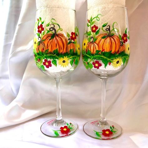 6 Pumpkins surround the glasses resting in vines and flowers. The base is clear with a small flower. Great fall glasses you can use for Halloween thru Thanksgiving. A nice hostess gift for your Thanksgiving dinner or add to your holiday tablescape. Can also be personalized and used at each Fall Glasses, Vines And Flowers, Wine Glass Decor, Holiday Tablescape, Donna Dewberry, Pumpkin Harvest, Diy Wine Glasses, Wine Painting, Painting Glass