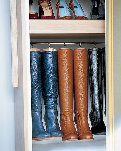 Made for Hanging  Homemade hangers preserve the shape of tall boots and maximize space. They're created by replacing the knobs on cedar boot trees with large cup hooks, which are screwed into the tops. The trees and boots then hang from a cafe-curtain rod. Fall Organization, Boot Hanger, Martha Stewart Home, Boot Organization, Cafe Curtain Rods, Boot Tree, Boot Storage, Organized Life, Home Organisation