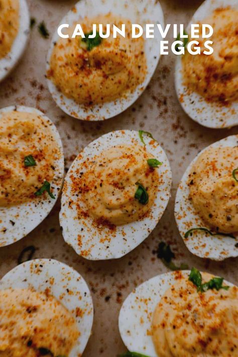 These Cajun deviled eggs are packed with a creamy blend of mayonnaise, mustard, paprika, hot sauce, and of course- a kick of Cajun seasoning. They’ll fly off the table! Cajun Deviled Eggs Recipe, Cajun Deviled Eggs, Bacon Crackers, Bacon Cracker, Deviled Eggs Recipe Easy, Avocado Deviled Eggs, Crackers Recipe, Bacon Appetizers, Classic Appetizers