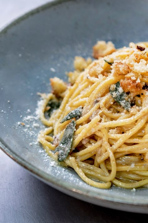 Speedy, simple and packed with flavour, chef Ben Tish's Sicilian recipe for spaghetti dressed with lemon, butter, anchovies and Parmesan is livened up with woody sage and crunchy pangrattato (breadcrumbs). It's a testament to just how good rustic Italian cuisine can be – just be sure to get hold of the best quality ingredients you can to make this dish really sing. Pangrattato Recipe, Spaghetti Lemon, Anchovy Pasta, Recipe For Pasta, Great British Chefs, Sicilian Recipes, Pasta Gnocchi, Rustic Italian, Chef Kitchen