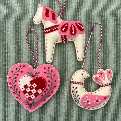 PLEASE NOTE! Physical items will not ship until the beginning of July, as I am taking a break during June. PDF items will be delivered immediately.  Delight your family and friends with a handmade ornament inspired by Scandinavian folk art. This is a PDF pattern to make my popular Scandinavian trio which includes the whimsical dala horse, folk bird, and woven heart. You will receive the patterns and complete instructions to make all three ornaments, as well as links to stitching guides and recom Scandinavian Felt Ornaments, Felt Christmas Ornaments Patterns Free, Scandinavian Folk Art Patterns, Felt Dala Horse, Felt Ornament Patterns, Nordic Ornaments, Scandinavian Ornaments, Folk Bird, Folk Christmas