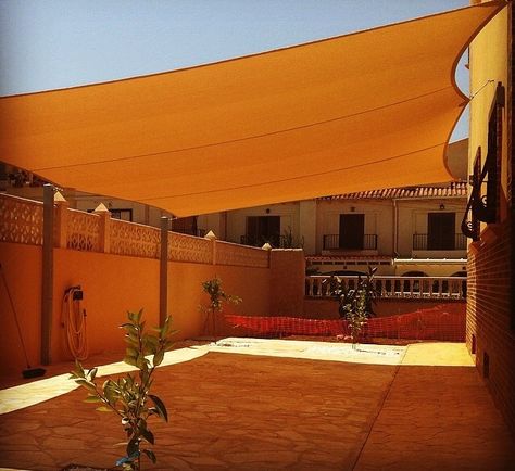 Sun shade sail Triangle Sun Sail Shade Ideas Patio, Courtyard Shade Sail, How To Attach Shade Sail To House, Canvas Sail Shade Patio, Beadboard Wall, Shade Sail Installation, Backyard Shade, Sun Sail Shade, Patio Projects