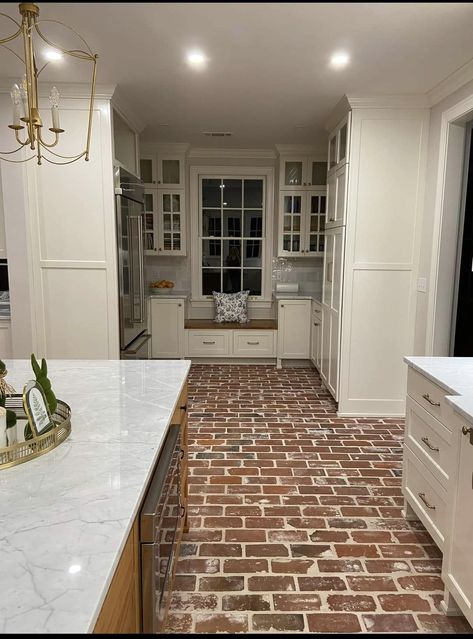 Split Brick Floor Kitchen, White Kitchen With Brick Floor, Red Brick Floor Kitchen, Kitchen Brick Flooring, Brick Floor Kitchen Modern, Brick Tile Floor Kitchen Farmhouse, Tumbled Marble Brick Floor Laundry, Kitchen With Brick Floor, Brick Floor Wood Cabinets