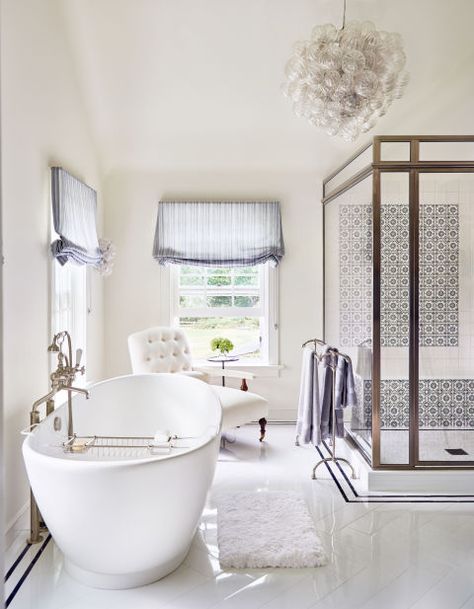 The bright, white master bath of Alec and Hilaria Baldwin's East Hampton home features Spanish-inspired blue and white tile from Stone Source, a bubble chandelier from Home Nature, and an elegant freestanding tub. Hampton Home, Hamptons House, Bathroom Style, Celebrity Houses, Beautiful Bathrooms, Bathroom Renovations, Luxury Bathroom, Elle Decor, Bathroom Inspiration