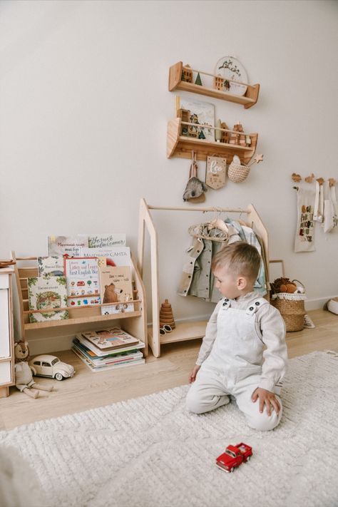 Looking for a wonderful storage option for kids? Our teepee clothes rack is an amazing way to accentuate a particular part of a playroom, nursery, or any other space. The reason why the Montessori kids wardrobe is ideal for little fashionistas is that it has a hang bar at the top and a shelf at the bottom. You can easily hang up the clothes of your little ones, place storage baskets, and add a bit of style and comfort to the room. Book Shelf Montessori, Wall Shelf Nursery, Shelf Clothing Rack, Toy Shelf, Montessori Books, Toy Shelves, Playroom Nursery, Kid Rooms, Wooden Rack