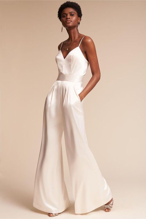 White silk jumpsuit! Perfect for the modern bride! Love this for a wedding reception! Bridal Jumpsuit The Bride, Reception Outfit For Bride, Jumpsuit Wedding Dress, Bride Jumpsuit, Wedding Reception Outfit, Wedding Pantsuit, Wedding Pants, Rehearsal Dinner Outfits, Reception Outfit