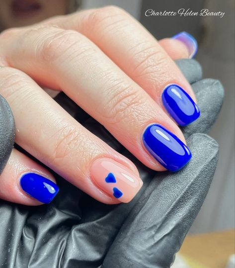 Gorgeous stand out blue with heart accents Royal Blue Nails With Hearts, Bright Dark Blue Nails, Blue Nails With A Heart, Sweethearts Nails, Nail Art Blue Electric, Nails With Blue Hearts, Valentines Day Nails Blue, Bright Blue Nails With Design, Blue Valentines Nails