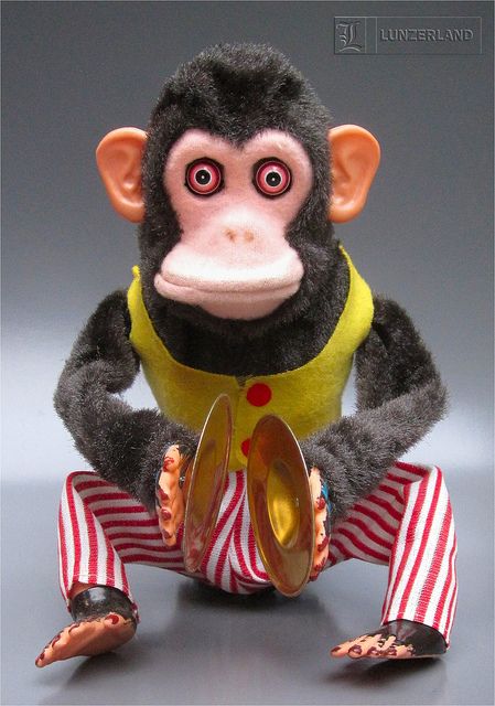 Vintage MUSICAL JOLLY CHIMP - 1950s Battery Operated MUSCIAL JOLLY CHIMP from the 1950s by CK-Daishin of Japan.The 10" tall chimp wildly plays his cymbals, but then push on the top of the head and he freaks out - shrieking, eyes bulge out, and he shows his teeth (really not quite so "jolly"). Recently featured in the Pixar film TOY STORY 3. Jolly Chimp, Circus Gifts, Looks Hip Hop, Rick And Morty Poster, Creepy Toys, Toy Monkey, Old School Toys, Monkey Doll, Pixar Films