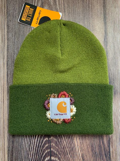 -Authentic Carhartt Knit Cuffed Beanie in the two-tone color "Light Moss" -Size Adult -100% Acrylic  Stand out in the crowd with this tried and true Carhartt beanie embellished with a whimsical hand embroidered floral design. Free-hand design created by me! Carhartt Beanie Embroidery, Toddler Carhartt Beanie, Embroidered Carhartt Beanie, Bonnet Carhartt, Toddler Carhartt, Beanie Embroidery, Embroidered Carhartt, Floral Beanie, Free Hand Designs