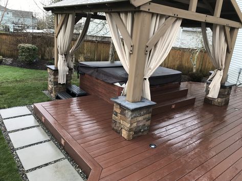 Deck around a new hot tub installation with overhead cover and outdoor privacy drapes. Hot Tub Decking, Outdoor Hot Tub Area, Pool Hut, Scheduling Employees, Yard Pergola, Hot Tub Deck Design, Hot Tub Area, Terrace Designs, Hot Tub Privacy