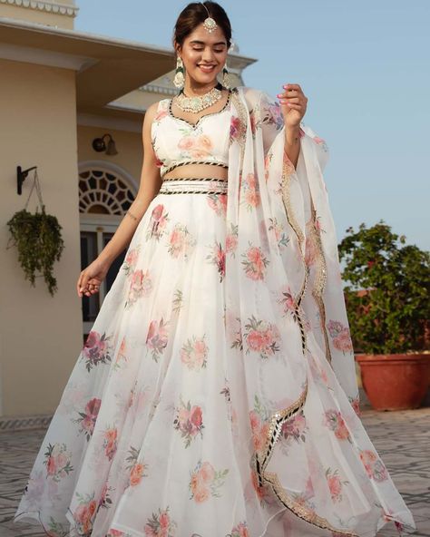 Embracing the elegance in white organza lehenga with floral print embroidery work lehenga detailing and organza dupatta 🤍✨ SHOP NOW 🛍️ gotifab.com [Indian ethnic, indian dress, handmade lehengas , indian wedding dresses, diwali sale, Navratri chaniya choli ,white lehengas ] #pinklehengas #whitelehenga #bridesmaidsdress #lenghacholi #navratrichaniyacholi #indianweddingdress #whitecroptop Organza Floral Lehenga, Floral Organza Lehenga, Organza Anarkali, Organza Frocks, Floral Organza Dress, Lehenga Choli For Women, Choli For Women, White Lehenga, Printed Organza