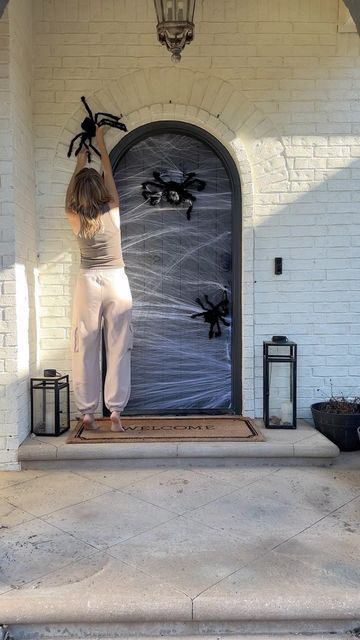 Lauren Clutter on Instagram: "Not a big Halloween decorator, but when the kids get this excited, how can I resist? 😅 Turned our front door into a spider’s dream with a few easy, budget-friendly touches! The kids are obsessed with their ‘spooky spiders’—and honestly, it might be growing on me too. 🕷️🕸️

Anyone else get pulled into holiday decorating for the kids? Let me know your favorite Halloween DIYs in the comments! 🎃

For links to spiders, webs, and lanterns comment SPOOKY

#HalloweenDecor #MomLife #SpookySeason #DIYHalloween #FamilyFun https://liketk.it/4Rx5U" Front Door Spider Web Decor, Spooky Front Door Decor, Spider Web Front Door, Homemade Witch Costume, Spiders Webs, Halloween Front Door, Spider Web Decoration, Halloween Front Doors, Dark Decor