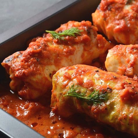 These tasty stuffed cabbage rolls (or gołąbki) are filled with soft rice and a savory blend of meat & veggies then baked in tomato sauce! #bakeitwithlove #cabbage #rolls #comfortfood #classic #recipe Cooked Vegetable Recipes, Cabbage Rolls Recipe, Stuffed Cabbage, Cabbage Rolls, Cabbage Recipes, European Food, Cooked Vegetables, Rolls Recipe, Hearty Meals