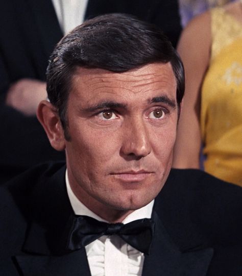 George Lazenby is James Bond 007 in "On Her Majesty's Secret Service". Personally, I never cared from Lazenby as Bond. However, I think the movie had great action sequences. If you are a fan of George Lazenby, please like or pin a few photos. James Bond Characters, James Bond Actors, Famous Legends, George Lazenby, Bond Series, Movie Studios, 007 James Bond, Ian Fleming, Roger Moore